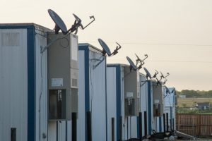 Modular building units with satellite dishes
